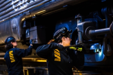 VIA Rail employee inspecting a train
